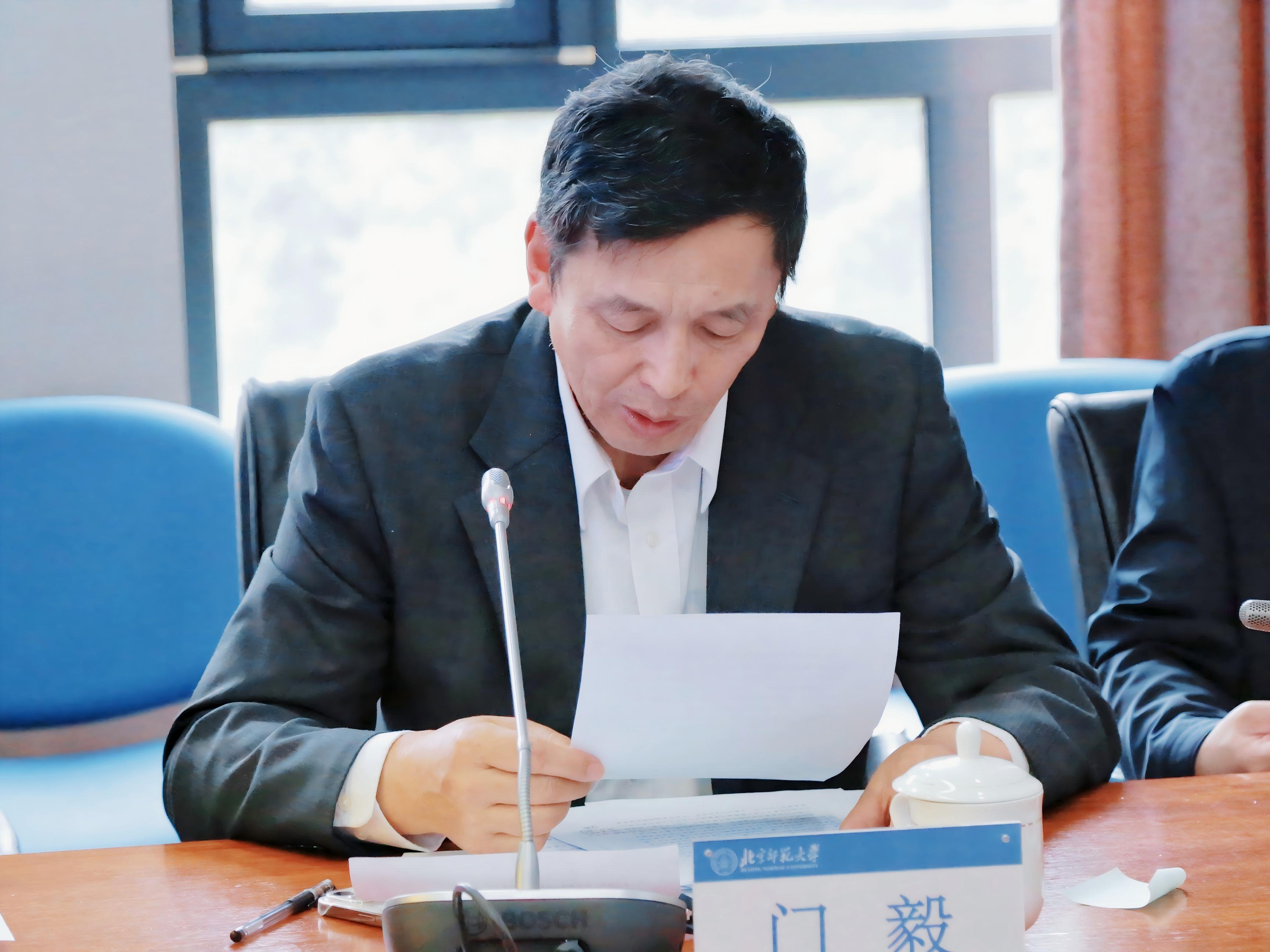 门毅作工作报告.jpg